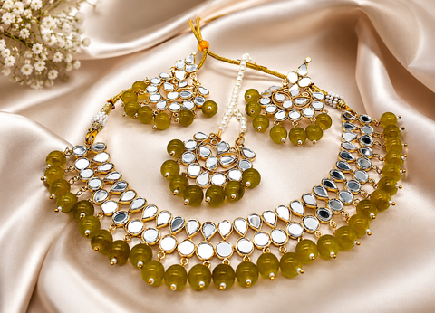 Elegant mirror necklace set adorned with beads and pearl detailing, perfect for adding a royal touch to your traditional look
 ( slight variation in color and design is possible )