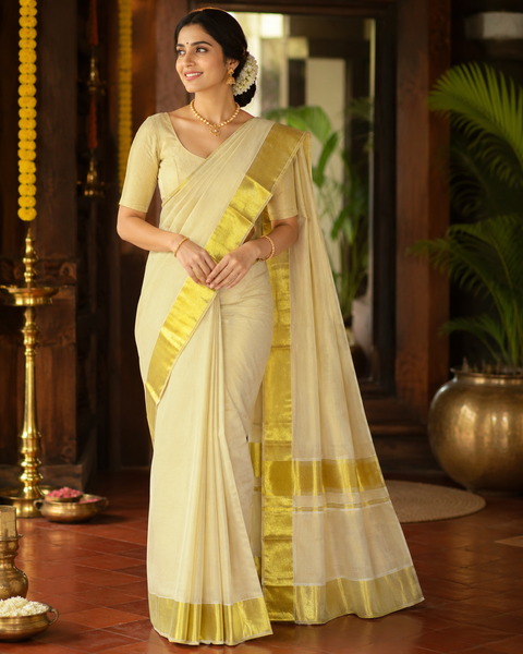Bright gold KERALA GOLD TISSUE WITH GOLD ZARI BORDER BEAUTIFUL SAREE(slight variation in color & design is possible)