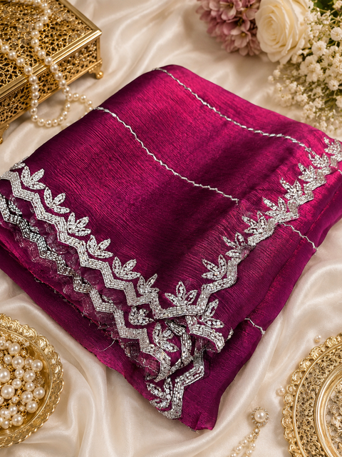 Elegant Jimmy Choo Saree featuring intricate handwork detailing and a beautifully embellished border. Comes with an attached matching blouse piece, blouse worn by the model is for reference purposes only(slight variation in color and design is possible)