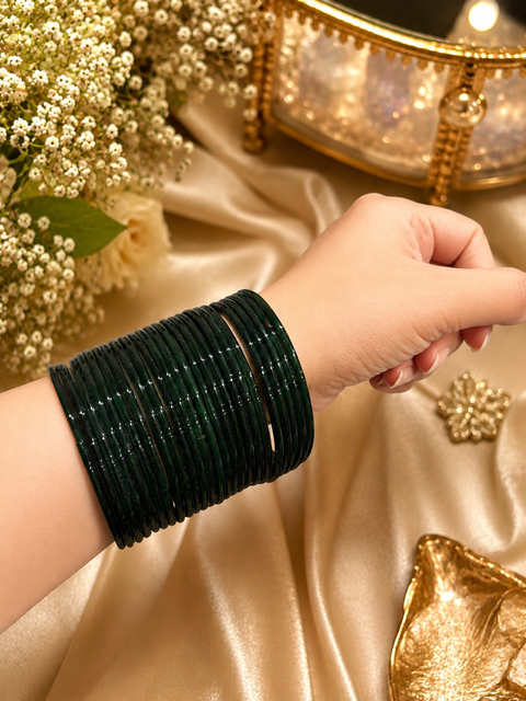 Kai Green color plain glass bangles. Each set includes 2 dozen bangles. Price is per set. Slight colour variation may occur