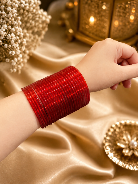 Red color plain gloss glass bangles. Each set includes 2 dozen bangles. Price is per set. Slight colour variation may occur