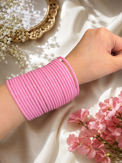Baby Pink color plain gloss glass bangles. Each set includes 2 dozen bangles. Price is per set. Slight colour variation may occur