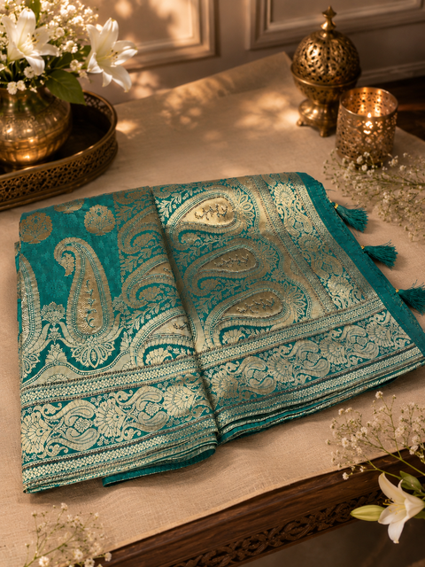 Banarasi Silk Saree Featuring Elegant Zari Weaving & stone work with tessels on Pallu Saree Comes With An Attached Blouse Piece. Model Blouse Is For Reference Only. Slight Variation In Colour And Design May Occur