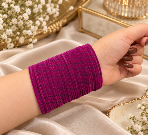 Elegant velvet bangles in a rich Deep Raspberry Pink shade, perfect for festive, bridal and traditional looks. Each pack includes 3 dozen bangles (36 pieces). Price is per pack. Slight variation in colour may be possible