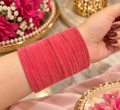 Elegant velvet bangles in a rich Deep Coral Pink shade, perfect for festive, bridal and traditional looks. Each pack includes 3 dozen bangles (36 pieces). Price is per pack. Slight variation in colour may be possible