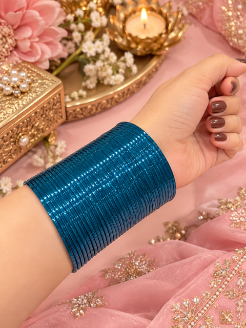 Peacock Blue color Elegant metal bangles.Pack includes 3 dozen bangles and the price is per pack. Slight variation in colour or design may be possible.