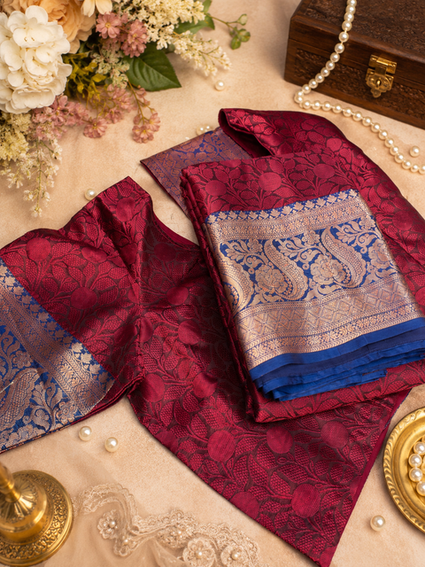 Soft Silk Saree with beautiful woven floral design and contrast zari border. Comes with stitched blouse (up to 44 inches). Perfect for festive and special occasions.
Note: Slight variation in color and design may be possible.