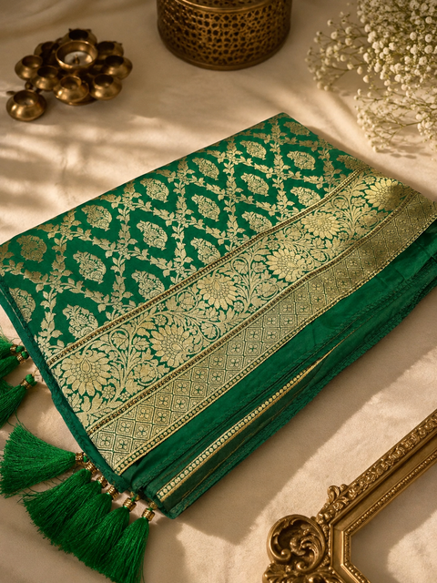 Elegant Banarasi Silk Saree with stone-work border. Blouse worn by the model is for reference only; saree comes with its own attached blouse piece. Slight variation in color and design may occur