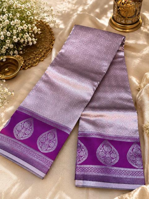 Premium South Silk Saree with rich zari weaving and contrast woven pallu. featuring elegant dual-tone shades.Model-worn blouse is for reference only. Unstitched blouse piece is attached with saree(slight variation in color & design is possible)