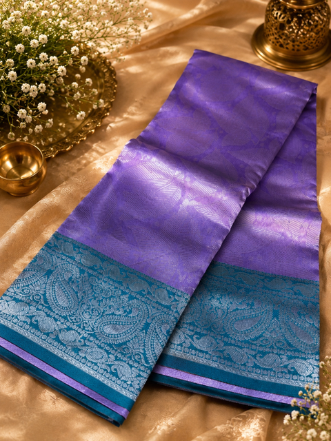 Premium South Silk Saree with rich zari weaving and contrast woven pallu. featuring elegant dual-tone shades.Model-worn blouse is for reference only. Unstitched blouse piece is attached with saree(slight variation in color & design is possible)