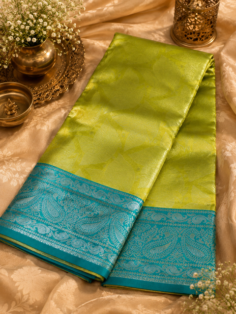 Premium South Silk Saree with rich zari weaving and contrast woven pallu. featuring elegant dual-tone shades.Model-worn blouse is for reference only. Unstitched blouse piece is attached with saree(slight variation in color & design is possible)