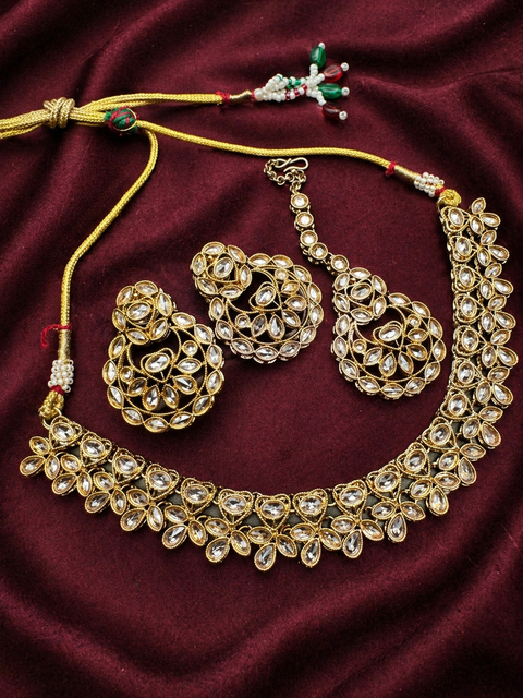 Original lite Gold Polki stones with jerkan stones necklace with earrings and tikka (slight variation in color is possible)