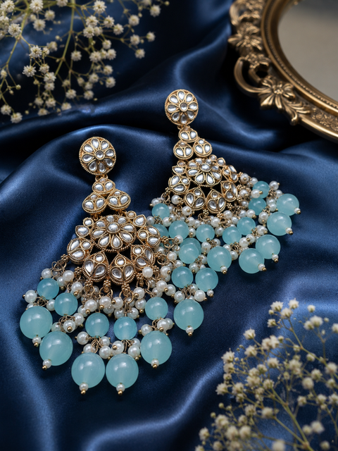 Kundan with beautiful pearls heavy look Earrings with lite weight (slight variations in color and design is possible)