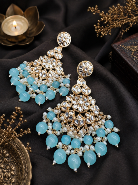 Kundan with beautiful pearls heavy look Earrings with lite weight (slight variations in color and design is possible)