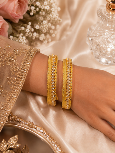 Golden American Diamond Kade Set ( slight variations in color and design is possible)