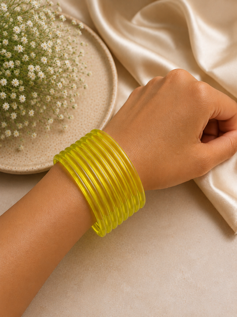 Yellow color Ultra-trendy jelly bangles with glossy vibrant shades — the perfect statement stack to elevate your everyday and festive looks (slight variation in color and design is possible) Eight bangles per set (price per set)