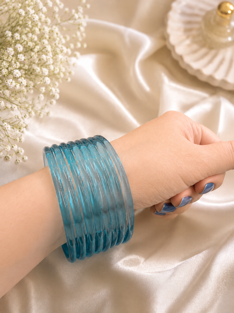 Lite Blue color Ultra-trendy jelly bangles with glossy vibrant shades — the perfect statement stack to elevate your everyday and festive looks (slight variation in color and design is possible) Eight bangles per set (price per set)