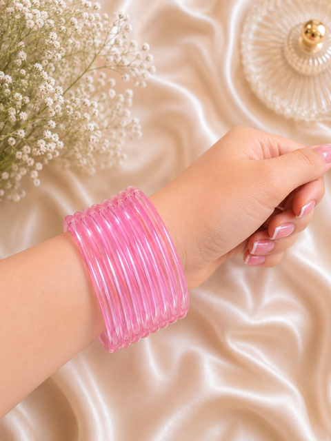 Lite Pink color Ultra-trendy jelly bangles with glossy vibrant shades — the perfect statement stack to elevate your everyday and festive looks (slight variation in color and design is possible) Eight bangles per set (price per set)