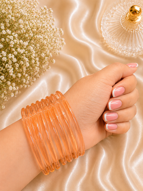 Pastel Peach color Ultra-trendy jelly bangles with glossy vibrant shades — the perfect statement stack to elevate your everyday and festive looks (slight variation in color and design is possible) Eight bangles per set (price per set)