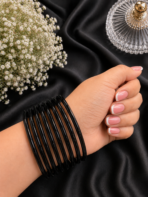 Black color Ultra-trendy jelly bangles with glossy vibrant shades — the perfect statement stack to elevate your everyday and festive looks (slight variation in color and design is possible) Eight bangles per set (price per set)