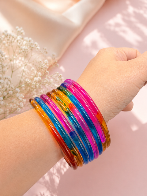 Multicoloured color Ultra-trendy jelly bangles with glossy vibrant shades — the perfect statement stack to elevate your everyday and festive looks (slight variation in color and design is possible) Eight bangles per set (price per set)