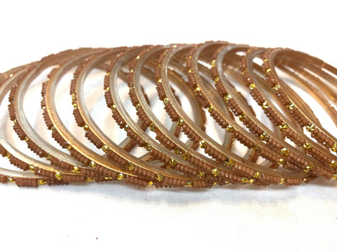 Glass bangles golden colour , 1 dozen in pack Size-2.10