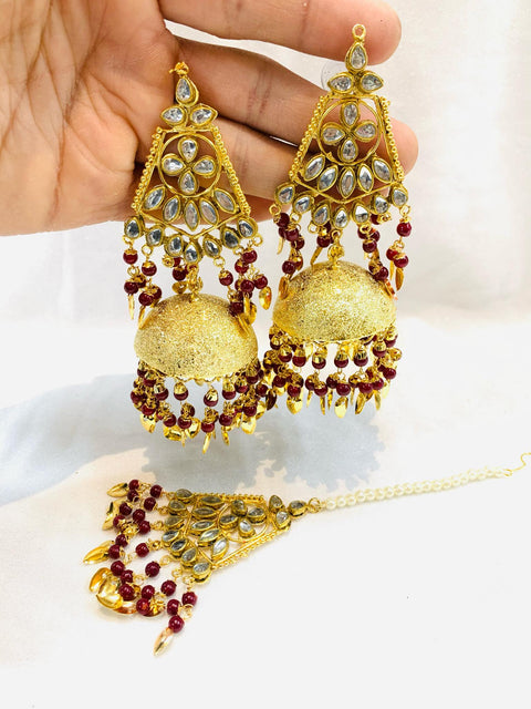 mehroon kundan stone & peepal patti punjabi jhumka and tika set