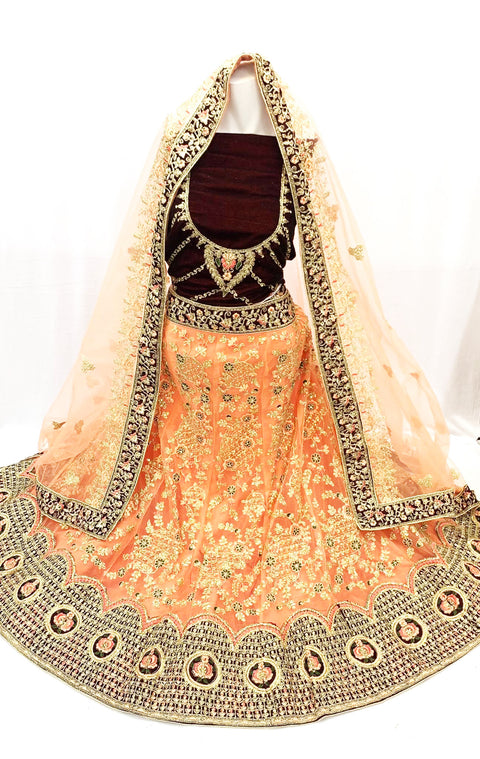 peach Heavy Embroidery And Stone Work Heavy Flared Netting Lehnga