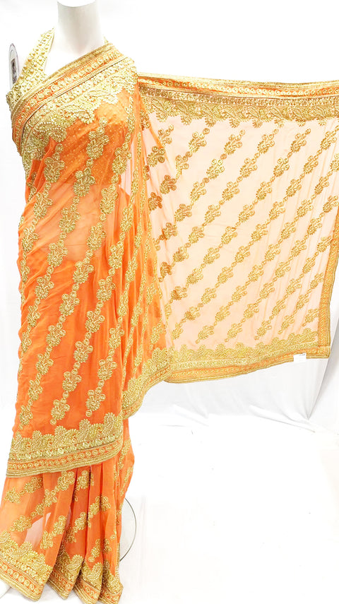 Heavy embroidered saree on orange pure georgette fabric