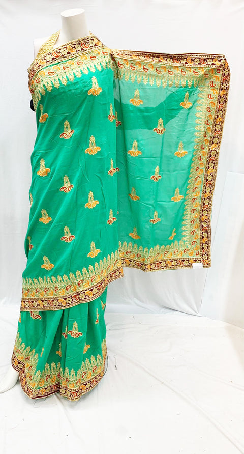 green colour heavy embroidery saree