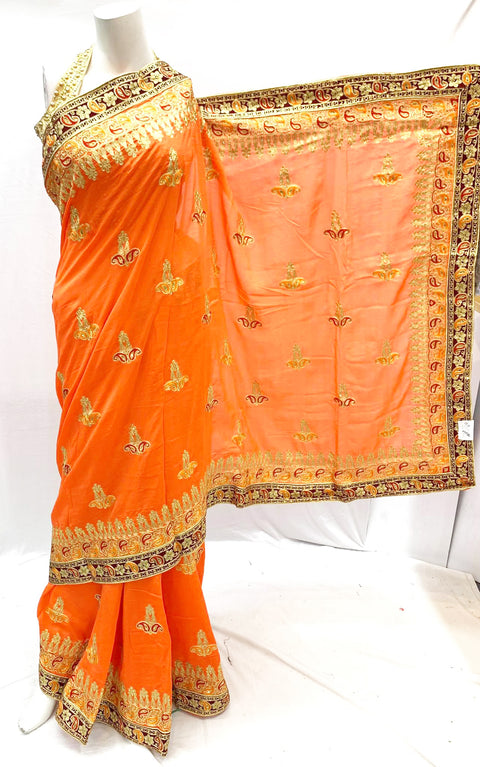 orange colour heavy embroidery saree
