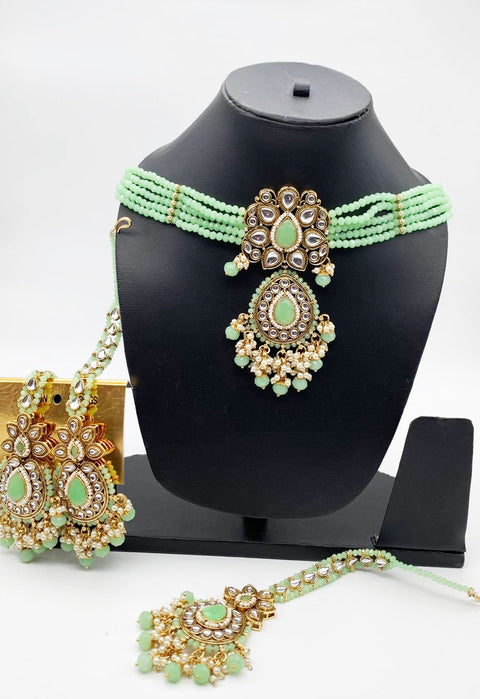 Pastel lime green Beautiful Pearls And Kundan Stone Chokar Set With Heavy Earrings And Tikka