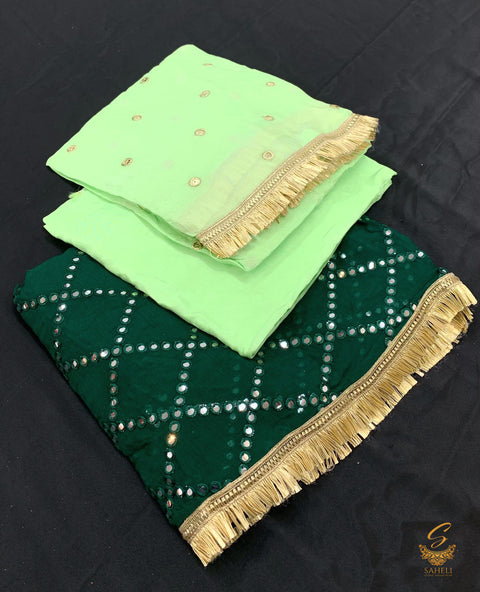 Dark forest green mirror work kameez with contrast bottom fabric and dupatta on chinnon based mirror work