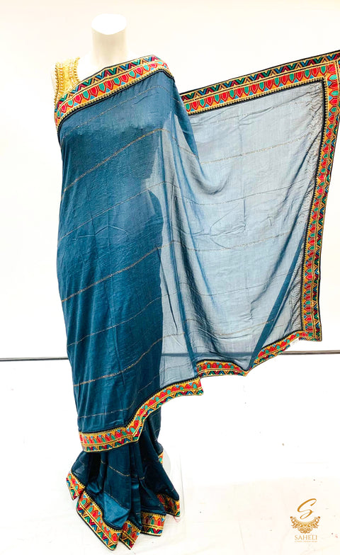 dark grey colour soft crape silk based embroidered broder with stone work saree