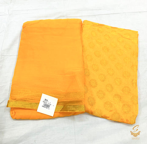 dark mustard colour plain chinnon saree with brocade blouse