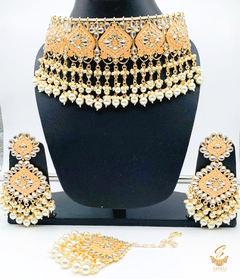 Dabi kundan with peach meenakri heavy choker set with tikka
