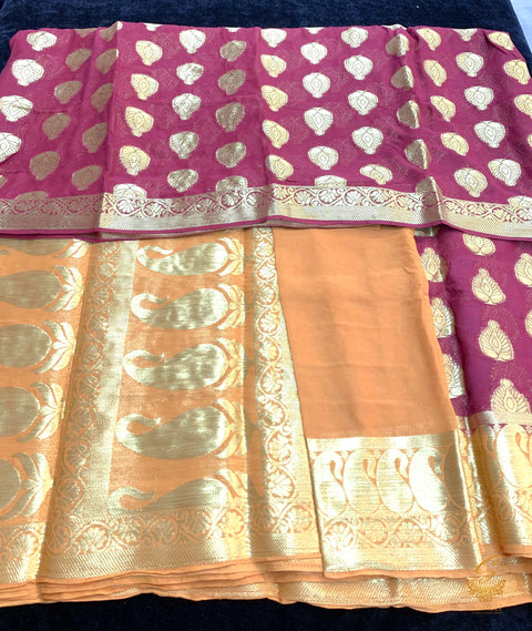 Dark purple colour chiffon silk saree with contrast orange colour border and pallu