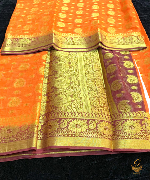 Dark orange colour chiffon silk saree with contrast deep maroon colour border and pallu
