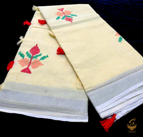 Pastel yellow colour linen saree with embroidery work