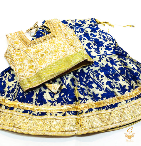 Golden brocade silk blouse with printed brocade silk lehnga & netting dupatta