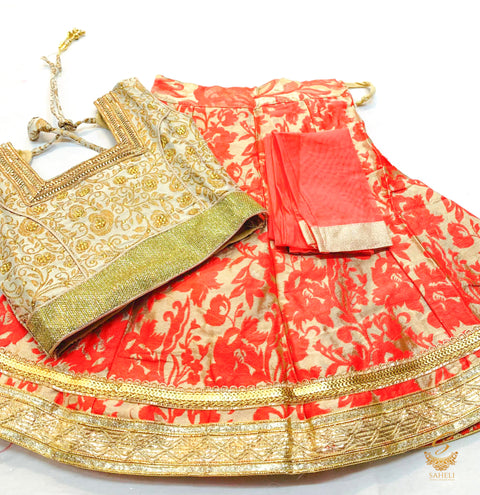 Golden brocade silk blouse with printed brocade silk peachy pink colour lehnga & netting dupatta