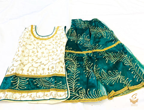 Golden colour silk based embroidered kameez with netting green colour plazo
