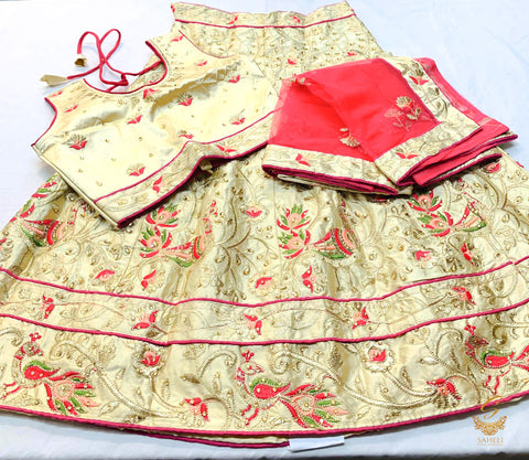 cream golden colour silk based heavy embroidered lehnga  with peach dupatta