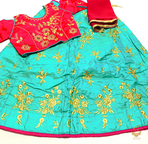 Hot pink silk blouse with turquoise colour embroidered lehnga