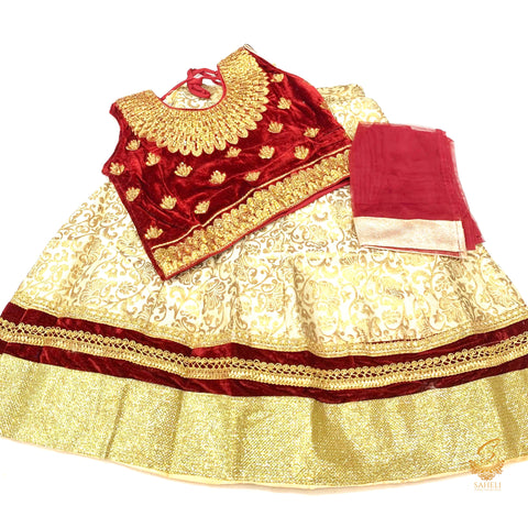 Maroon colour velvet based blouse with embroidery & Stone work with golden brocade silk Lehnga & netting dupatta