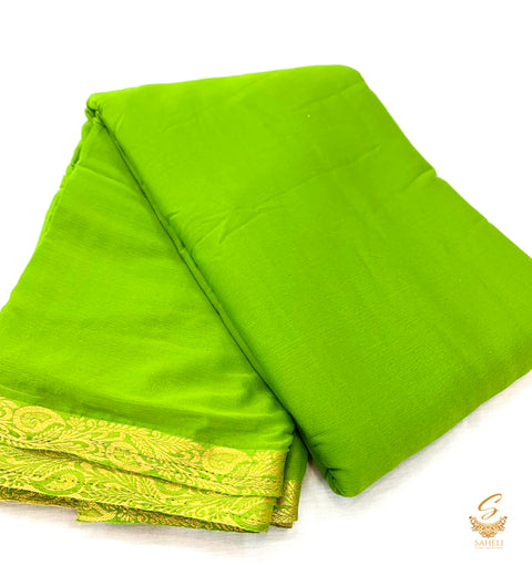 Dark Lime green colour pure chinnon plain saree with zari border