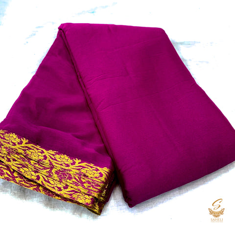 Dark burgundy colour pure chinnon plain saree with zari border