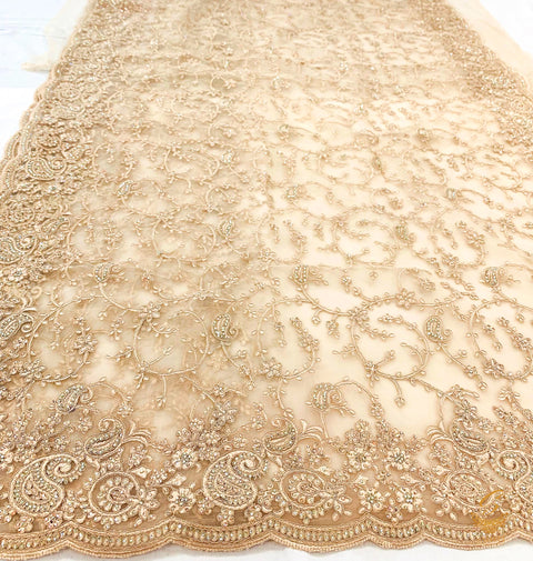Rosegold colour netting based heavy embroidery jaal work with stones all over with heavy work on blouse