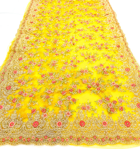 Dark Yellow colour netting based heavy embroidery floral jaal work with stones all over with heavy work on blouse
