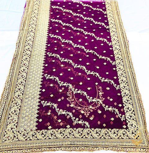 Dark purple wine colour netting based heavy embroidery jall all over with beautiful stone work heavy border and embroidered work design on blouse